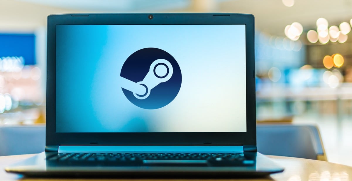 A person viewing a gaming laptop screen displaying a game interface, showcasing image.